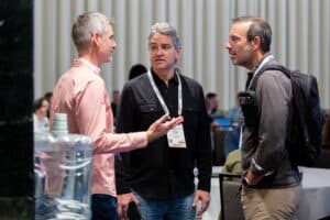 Group of people networking at CommerceNext